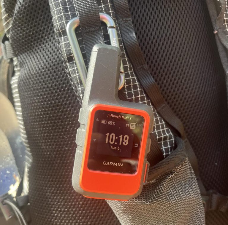 Garmin inReach Mini 2 Review. satellite communicator clipped to a backpack strap for trail safety